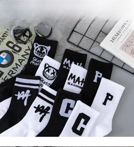 Detail of cotton crew socks featuring street-style graffiti patterns and letter motifs