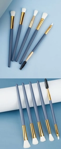 Detailed set of 5 blue eye makeup brushes with gold ferrule and white soft bristles