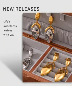 Chic geometric metal earrings displayed in a luxury velvet lined jewelry box
