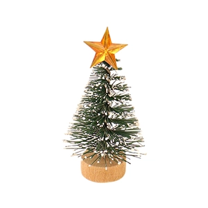 Miniature green Christmas tree with white snow effect, golden star, and wooden base stand