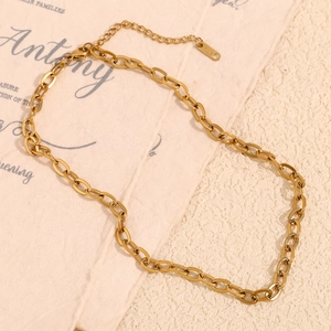 18K gold-plated stainless steel cable chain necklace with K18 tag on textured paper