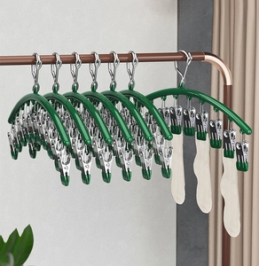 Close-up of windproof stainless steel drying rack with multiple clips for socks