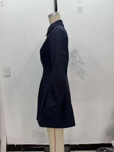 Side view of navy blue button-down shirt dress with waist tie and side pocket