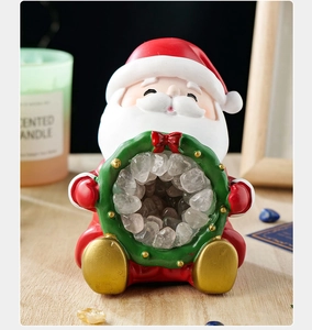 Close-up of Santa Claus ornament with green wreath filled with natural clear crystals