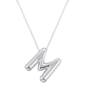 Macro shot of a silver balloon letter M pendant on a delicate polished box chain