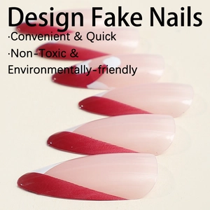 Christmas-themed French almond press-on nails with red diagonal tips and white accents