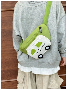 Detail of green cartoon car waist bag for kids with adjustable strap and zipper