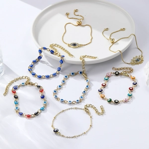 Bohemian evil eye charms bracelets with gold plating and adjustable slider chain for women