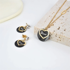 Golden heart necklace and earrings set with Love engraving and zircon accents