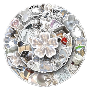 Stack of silver Y2K aesthetic waterproof stickers with metallic floral and star designs