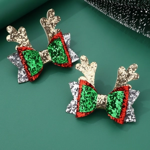 Christmas reindeer horn bow hair clips with sequins in festive red and green colors