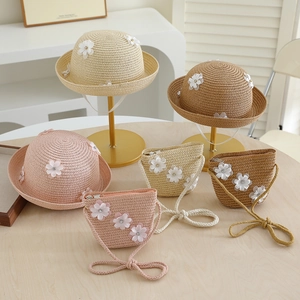 Kids woven straw hat and matching bag set with floral accents for summer travel