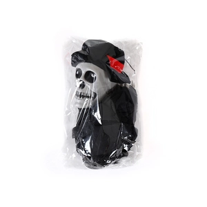 Close-up of a hanging skeleton ghost in black suit for Halloween party decoration