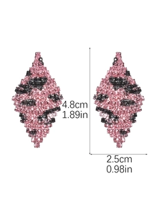 Detailed view of bohemian rhombic drop earrings with pink and black rhinestones