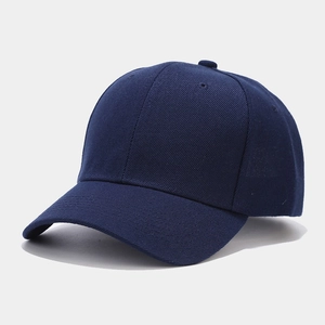 Detail of navy blue cotton twill baseball cap with reinforced stitching and ventilation holes
