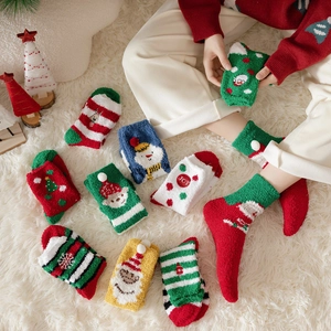 Set of cozy Christmas themed coral fleece socks featuring cute holiday cartoon patterns