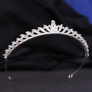 Detailed view of silver bridal tiara crown featuring sparkling zircon and rhinestones