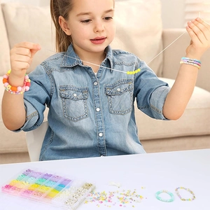 DIY bead set with colorful hearts and alphabet beads in a 24-grid organizer box