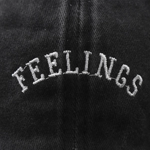 Classic washed cotton baseball cap with Feelings embroidery detail in black color