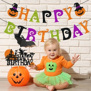 Halloween theme birthday party decorations with glitter banner and pumpkin bucket