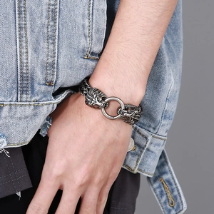 Detailed view of punk lion head clasp on vintage silver steel chain bracelet