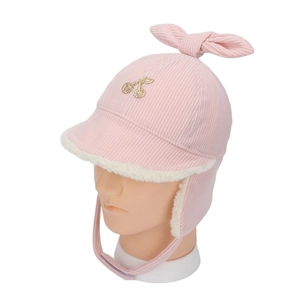 Detail view of pink corduroy baby trapper hat with golden cherry embroidery and bow