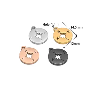 Set of four hollow compass pendants in gold, silver, rose gold and black stainless steel