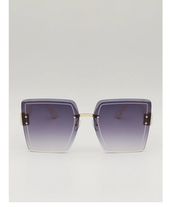 Detail of square oversized sunglasses with purple gradient lenses and gold bridge