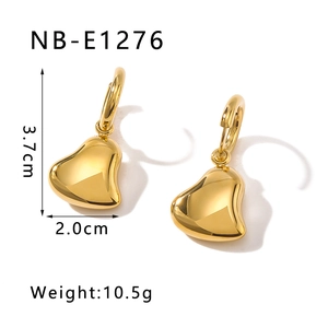 Detail view of 3D hollow heart earrings in gold finish with 3.7cm height measurements