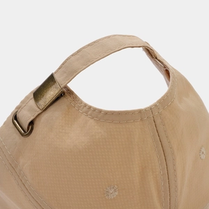 Macro shot of khaki quick-dry baseball cap with metal buckle and adjustable back strap