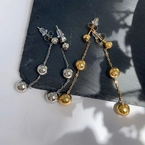 Polished gold and silver stainless steel triple ball drop earrings with long chain fringe