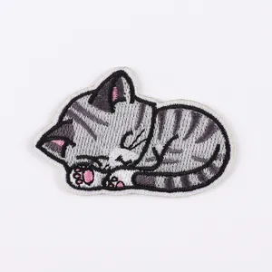 Detail of sleeping cat embroidery patch with dimensions 4cm by 6cm and vivid textures