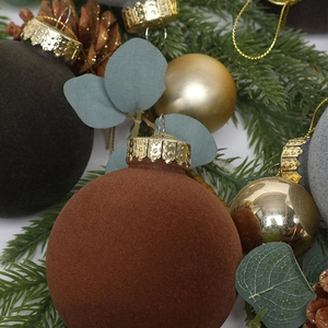 Velvet texture Christmas balls set in brown, grey, and gold with pine cones and eucalyptus