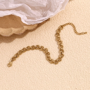 Detailed view of 14K gold plated chunky round link anklet with adjustable lobster clasp