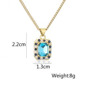 Detail view of gold square necklace with blue stone showing 2.2cm pendant dimensions