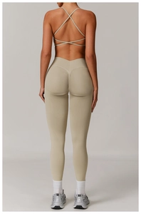 Detail of high-waist yoga pants with ruched butt lift and criss-cross back sports bra