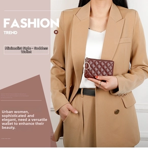 Detail of dark brown quilted PU leather coin purse with a gold metal keyring