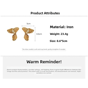 Macro detail of gold crinkled flower earrings with dimensions 8.6cm by 5cm for fashion use