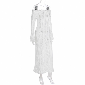 Detail of white lace off-shoulder dress featuring bell sleeves and floral patterns