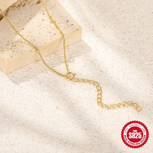 Minimalist gold S925 sterling silver U-shaped double-ring necklace on stone surface