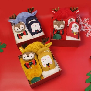 Christmas gift set for kids with knit hat scarf and gloves in festive gift boxes