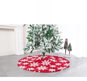 Red plush Christmas tree skirt with white snowflake patterns for holiday decoration
