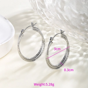 Detailed view of silver hoop earrings with triple layer texture measuring 3cm in diameter