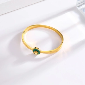 Vintage gold-plated titanium steel cuff bracelet featuring a green floral shell inlay
