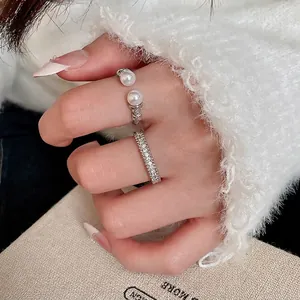 Stackable silver finish zircon ring set with lustrous white pearls in a minimalist design