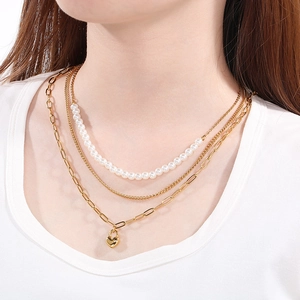 Three-layer layered gold stainless steel necklace with white pearls and heart lock pendant