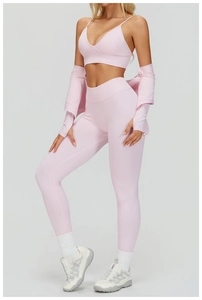 Detailed full set of light pink high-waisted yoga pants and sports bra with matching cardigan