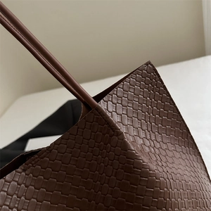 Large dark brown woven tote bag for women with minimalist retro shoulder strap design