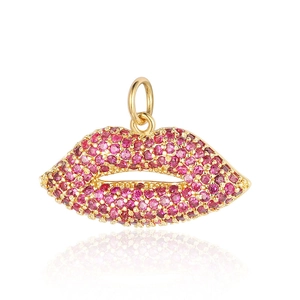 Macro shot of a gold-plated lip pendant with pink cubic zirconia stones for jewelry making