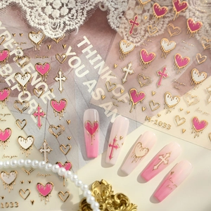 Golden heart and cross nail stickers M-1033 with metallic drip design on display